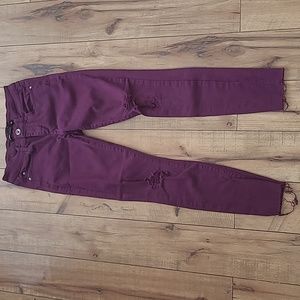 Distressed purple skinny jeans